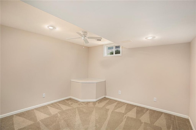spare room featuring light colored carpet, baseboards, and recessed lighting