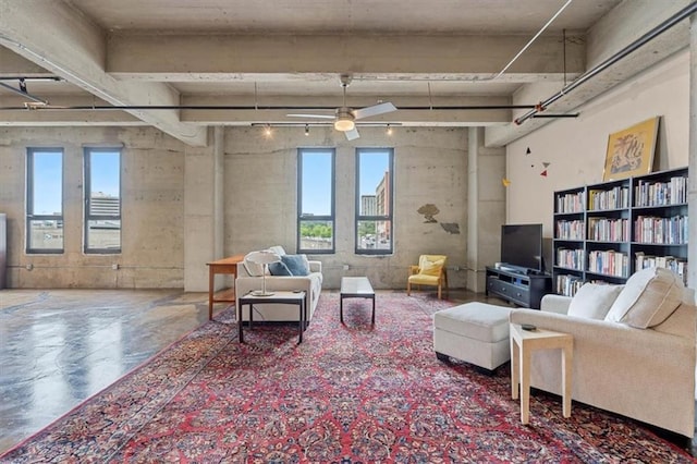 360 W Pershing Rd Unit 210, Kansas City, MO 64108 - living room with a ceiling fan and finished concrete flooring