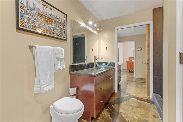 360 W Pershing Rd Unit 210, Kansas City, MO 64108 - bathroom with vanity, marble tiled flooring, toilet, and inlaid floor details