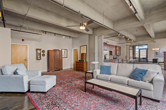 360 W Pershing Rd Unit 210, Kansas City, MO 64108 - living room featuring track lighting, ceiling fan, and beam ceiling