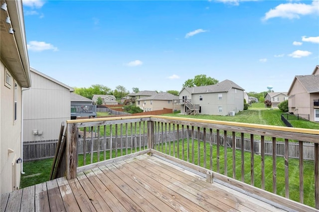 wooden terrace with a residential view