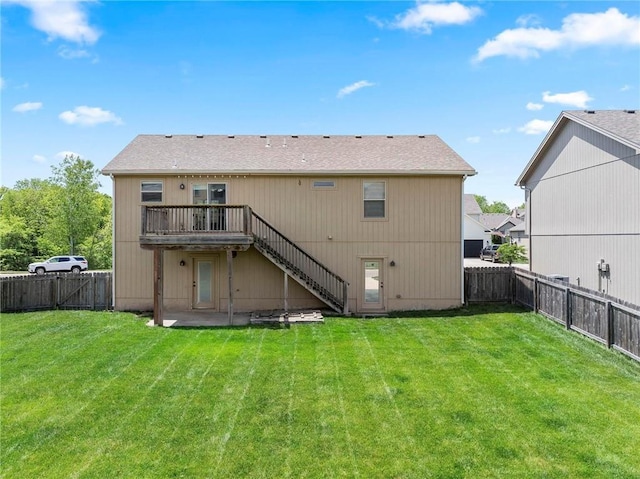 back of house featuring stairway and a wooden deck