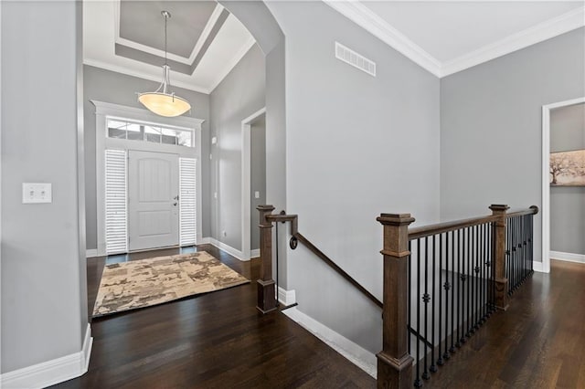 16609 Cody St, Overland Park, KS 66221 - entrance foyer featuring wood finished floors, arched walkways, and ornamental molding