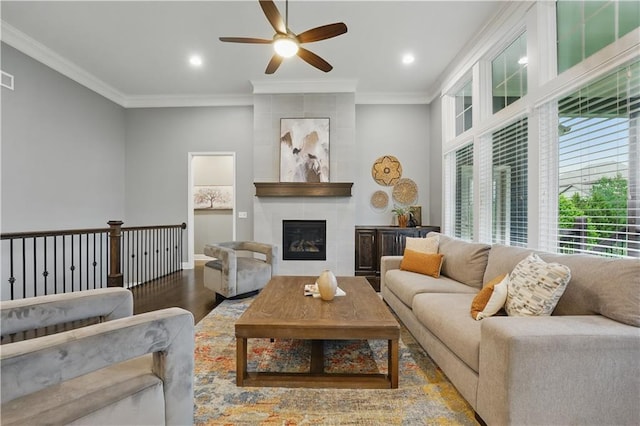 16609 Cody St, Overland Park, KS 66221 - living room with a ceiling fan, wood finished floors, ornamental molding, a fireplace, and recessed lighting
