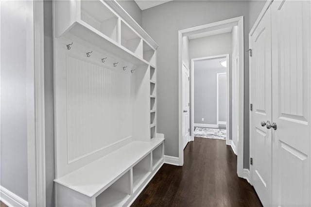 16609 Cody St, Overland Park, KS 66221 - mudroom featuring dark wood finished floors and baseboards