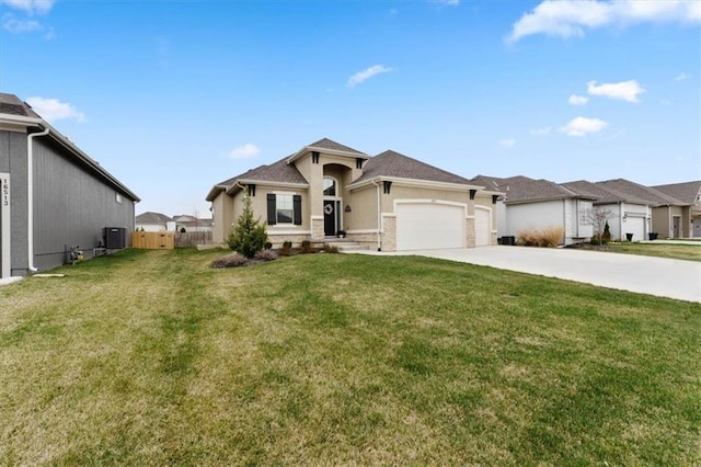 16521 S Stagecoach St, Olathe, KS 66062 - view of front of house featuring driveway, an attached garage, stucco siding, and central air condition unit
