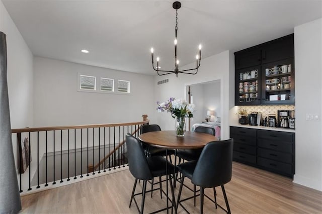 16521 S Stagecoach St, Olathe, KS 66062 - dining area with light wood-style floors, a chandelier, and recessed lighting