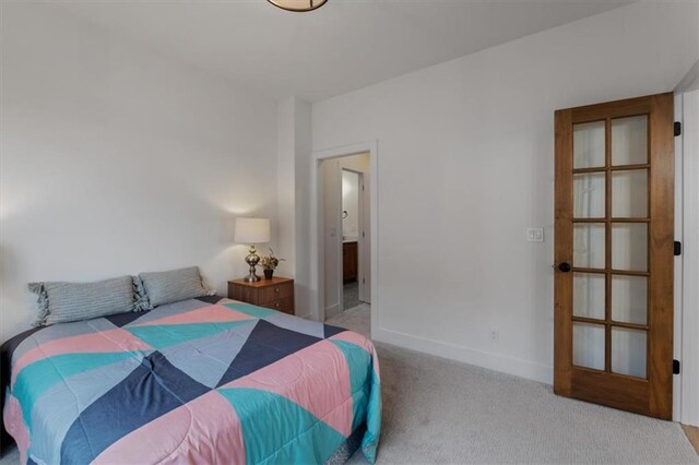 16521 S Stagecoach St, Olathe, KS 66062 - bedroom with carpet floors, baseboards, and connected bathroom