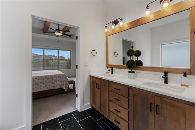 16521 S Stagecoach St, Olathe, KS 66062 - bathroom with marble look tiles, a ceiling fan, double vanity, baseboards, and ensuite bath