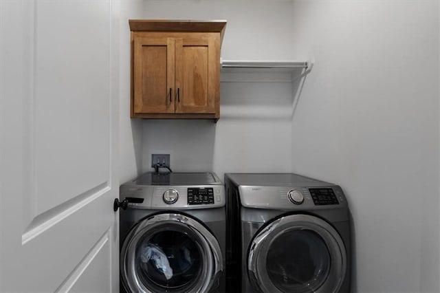 16521 S Stagecoach St, Olathe, KS 66062 - laundry room with washer and clothes dryer and cabinet space