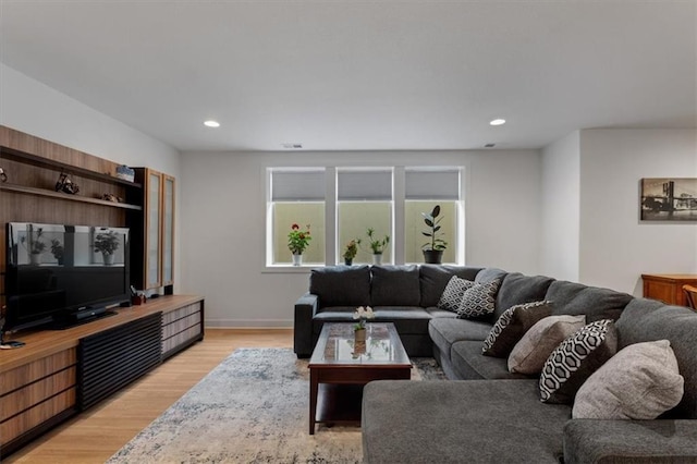 16521 S Stagecoach St, Olathe, KS 66062 - living room with light wood finished floors, recessed lighting, and baseboards