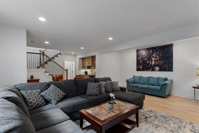 16521 S Stagecoach St, Olathe, KS 66062 - living room featuring light wood-type flooring, stairs, recessed lighting, and baseboards