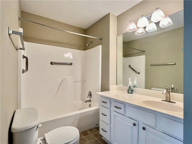 bathroom with toilet, vanity, shower / washtub combination, and tile patterned flooring