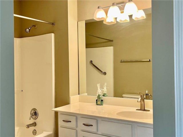 full bath featuring vanity, bathtub / shower combination, a chandelier, and toilet