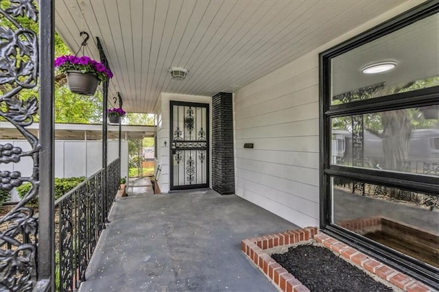 2647 Minnesota Ave, Kansas City, KS 66102 - doorway to property with a porch and a carport