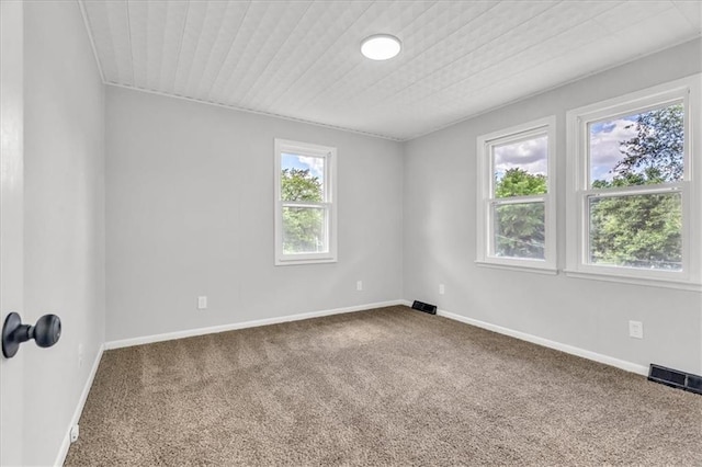 2647 Minnesota Ave, Kansas City, KS 66102 - unfurnished room with carpet flooring, wooden ceiling, and baseboards