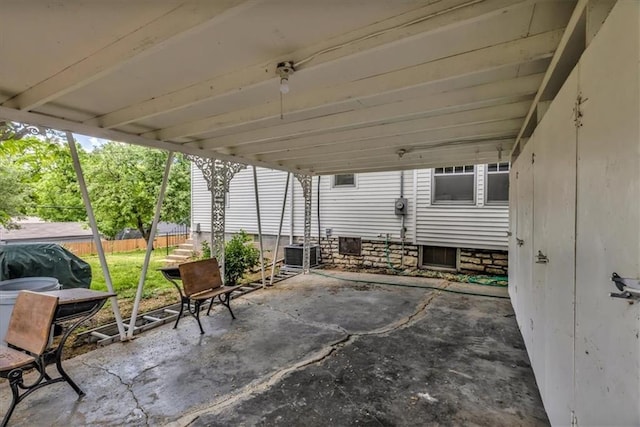 2647 Minnesota Ave, Kansas City, KS 66102 - view of patio with fence, cooling unit, and a carport