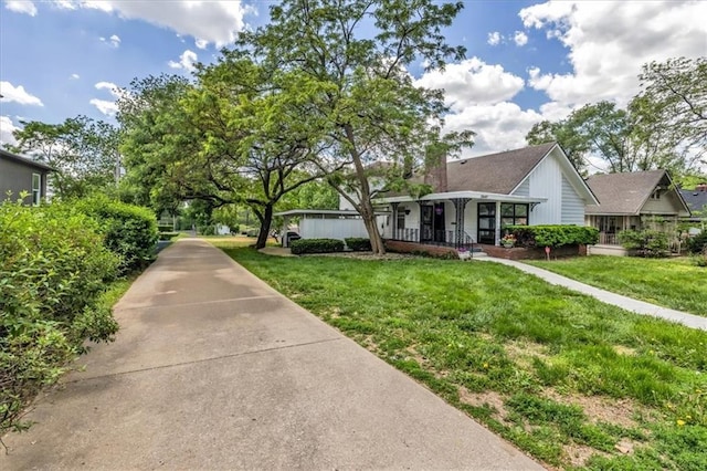 2647 Minnesota Ave, Kansas City, KS 66102 - view of front facade featuring a porch and a front lawn