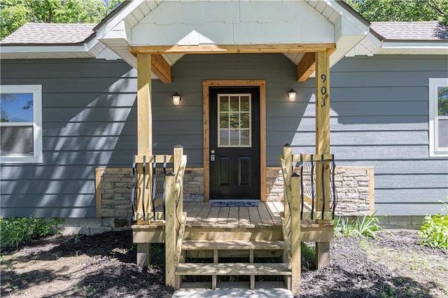 901 N 9th St, Neodesha, KS 66757 - property entrance with covered porch and a shingled roof