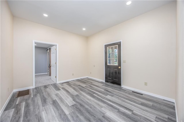 901 N 9th St, Neodesha, KS 66757 - unfurnished room with wood finished floors, baseboards, and recessed lighting