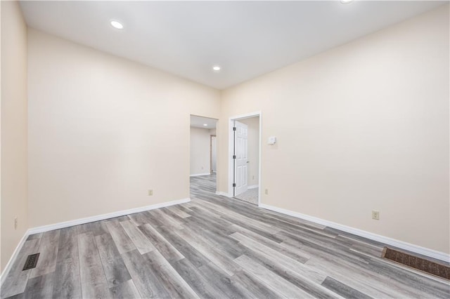 901 N 9th St, Neodesha, KS 66757 - unfurnished room with wood finished floors, baseboards, and recessed lighting