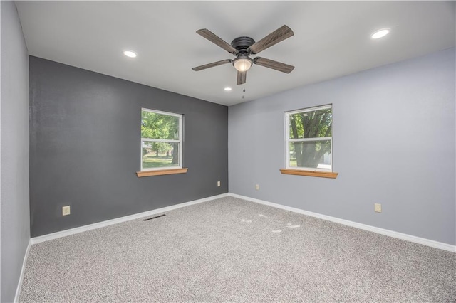 901 N 9th St, Neodesha, KS 66757 - carpeted empty room with healthy amount of natural light, recessed lighting, ceiling fan, and baseboards