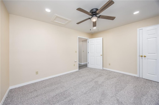 901 N 9th St, Neodesha, KS 66757 - unfurnished bedroom featuring attic access, carpet flooring, baseboards, recessed lighting, and ceiling fan