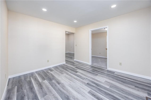 901 N 9th St, Neodesha, KS 66757 - spare room with wood finished floors, baseboards, and recessed lighting