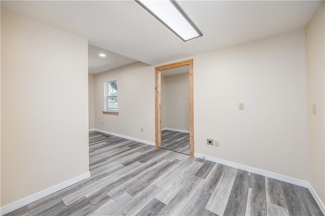 901 N 9th St, Neodesha, KS 66757 - spare room with wood finished floors, baseboards, and recessed lighting