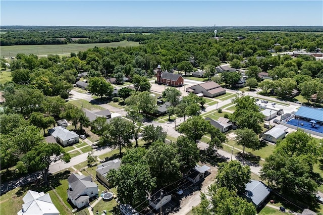 901 N 9th St, Neodesha, KS 66757 - aerial view of residential area with a heavily wooded area