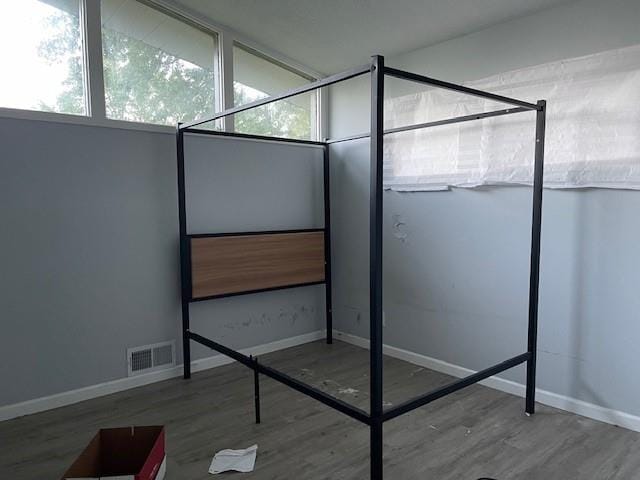 3602 Rowland Ave, Kansas City, KS 66104 - unfurnished bedroom with wood finished floors and baseboards