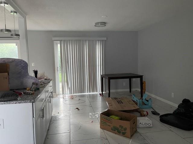 3602 Rowland Ave, Kansas City, KS 66104 - living area with light marble finish floors and baseboards