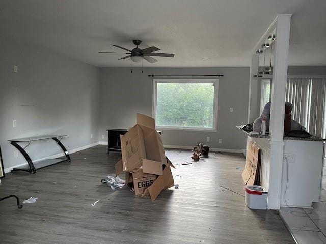 3602 Rowland Ave, Kansas City, KS 66104 - living area with ceiling fan, baseboards, and wood finished floors