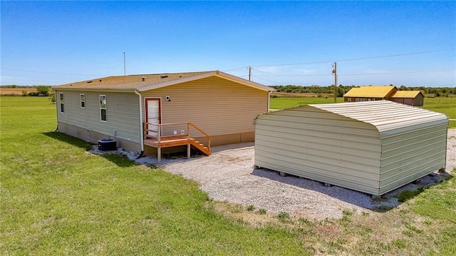 1365 NW 460th Rd, Holden, MO 64040 - rear view of house with a lawn