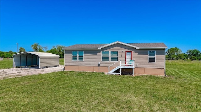 1365 NW 460th Rd, Holden, MO 64040 - rear view of property with a lawn and a carport