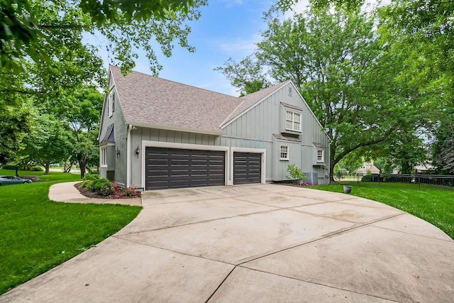12808 Howe Dr, Leawood, KS 66209 - view of side of property featuring roof with shingles, an attached garage, concrete driveway, and board and batten siding