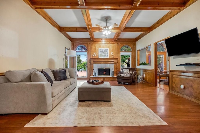 12808 Howe Dr, Leawood, KS 66209 - living room featuring a ceiling fan, wood finished floors, coffered ceiling, beamed ceiling, and a tile fireplace