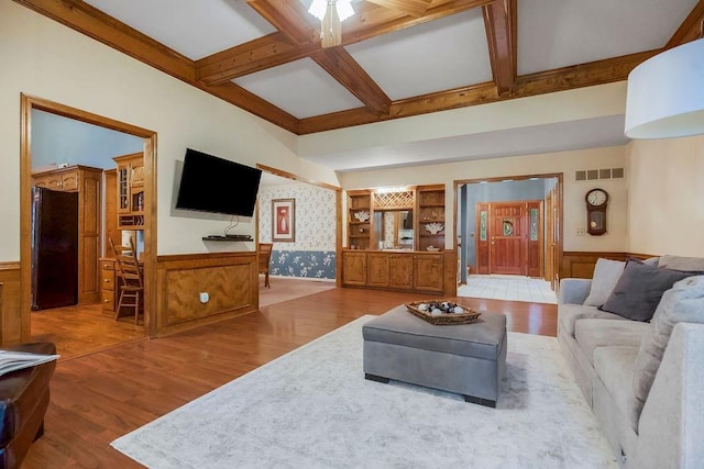 12808 Howe Dr, Leawood, KS 66209 - living area featuring a wainscoted wall, wood finished floors, beamed ceiling, coffered ceiling, and built in features