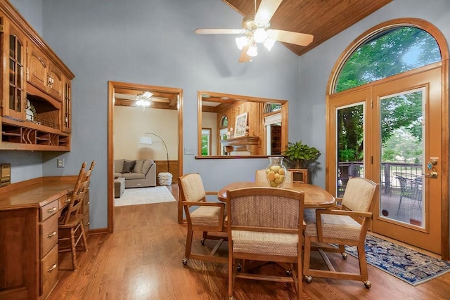 12808 Howe Dr, Leawood, KS 66209 - dining area with ceiling fan, light wood-style floors, and high vaulted ceiling