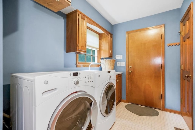 12808 Howe Dr, Leawood, KS 66209 - laundry room featuring washer and clothes dryer and cabinet space
