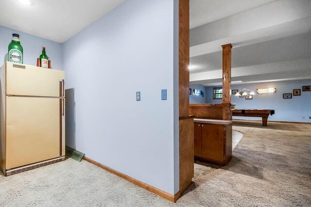 12808 Howe Dr, Leawood, KS 66209 - kitchen with freestanding refrigerator, billiards, baseboards, and light carpet