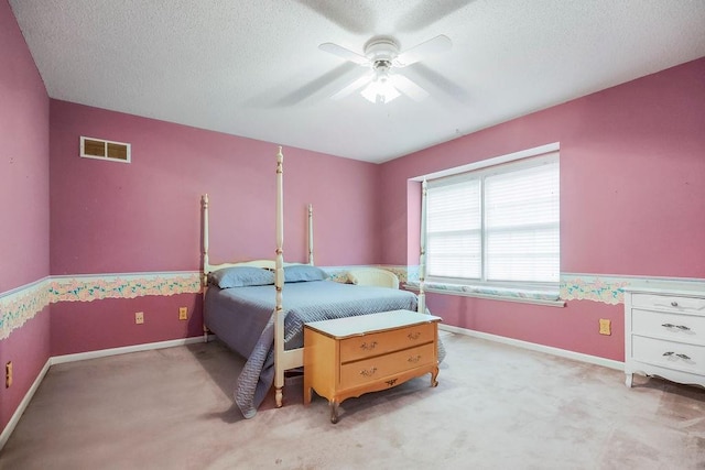 12808 Howe Dr, Leawood, KS 66209 - bedroom featuring a textured ceiling, light carpet, baseboards, and ceiling fan