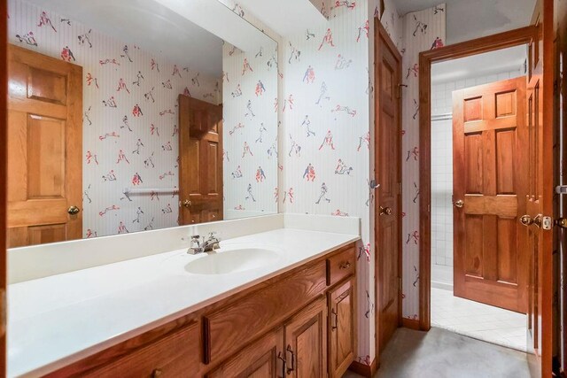 12808 Howe Dr, Leawood, KS 66209 - bathroom featuring wallpapered walls and vanity