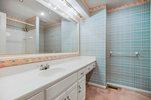 12808 Howe Dr, Leawood, KS 66209 - bathroom with vanity and a tile shower
