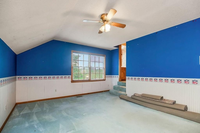 12808 Howe Dr, Leawood, KS 66209 - bonus room with a wainscoted wall, carpet floors, vaulted ceiling, ceiling fan, and stairway