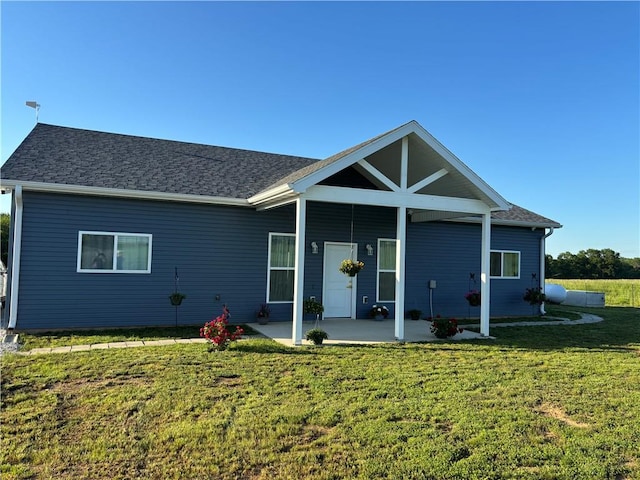 25385 E 54th Hwy E, Mo, MO 64790 - single story home with a patio and a front yard