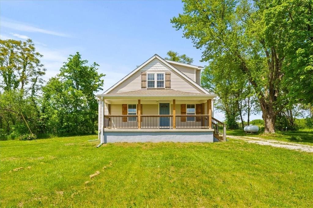 view of front of property with a porch and a front yard