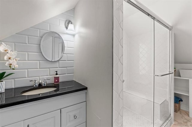 4111 W 69th St, Prairie Village, KS 66208 - bathroom with a stall shower, marble look tiles, vanity, and tasteful backsplash