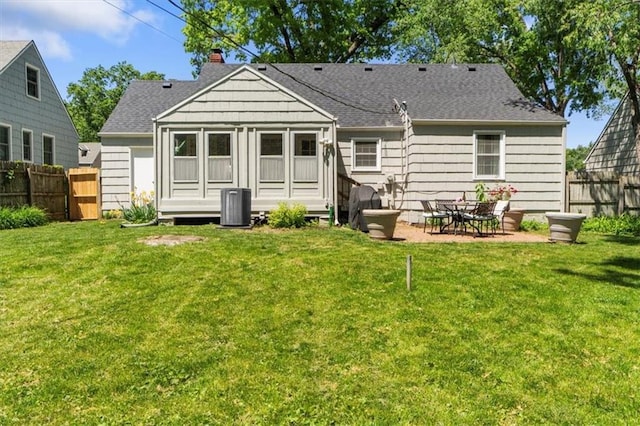 4111 W 69th St, Prairie Village, KS 66208 - rear view of house with a chimney, cooling unit, roof with shingles, and a patio area