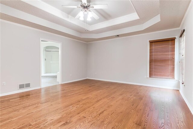 6402 W 147th Ter, Overland Park, KS 66223 - empty room with a raised ceiling, ceiling fan, crown molding, wood finished floors, and baseboards